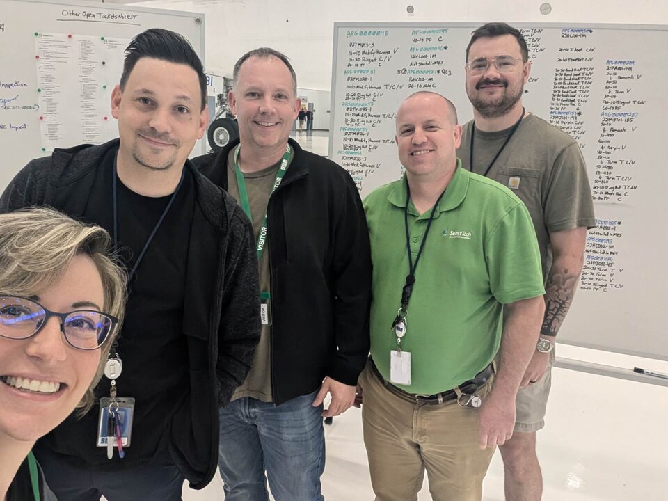 Team in-front of whiteboards